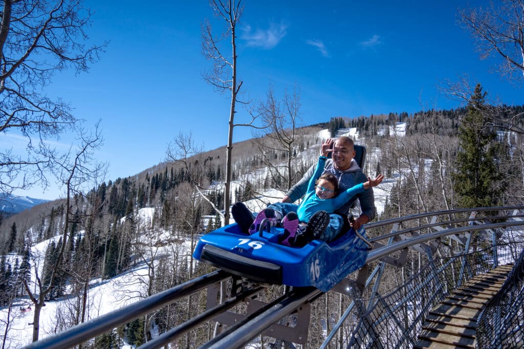 A father and daughter enjoy the Inferno Mountain Coaster
