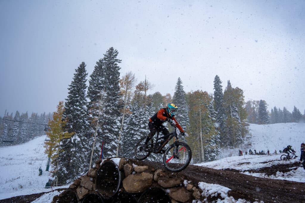 Snow starts falling heavy on a rider during warm ups on the duel slalom course.