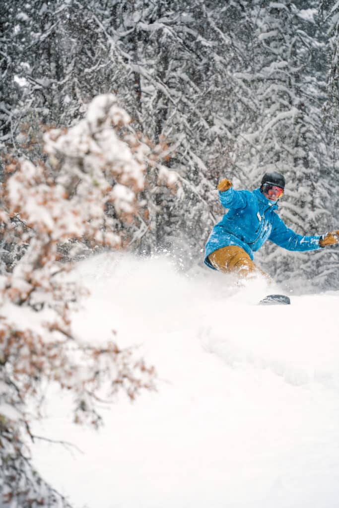 Purgatory employee shredding through some knee high powder