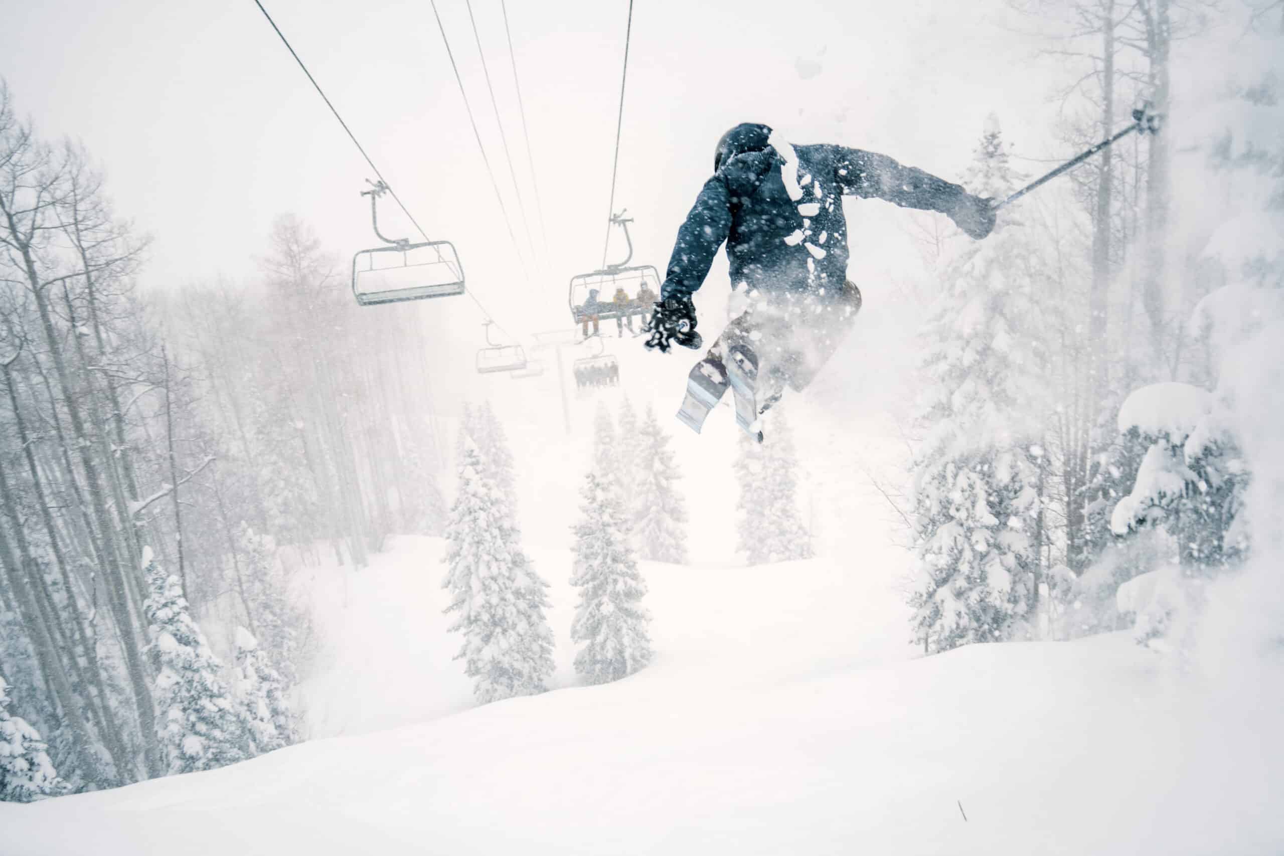 Skier catching air on a powder day