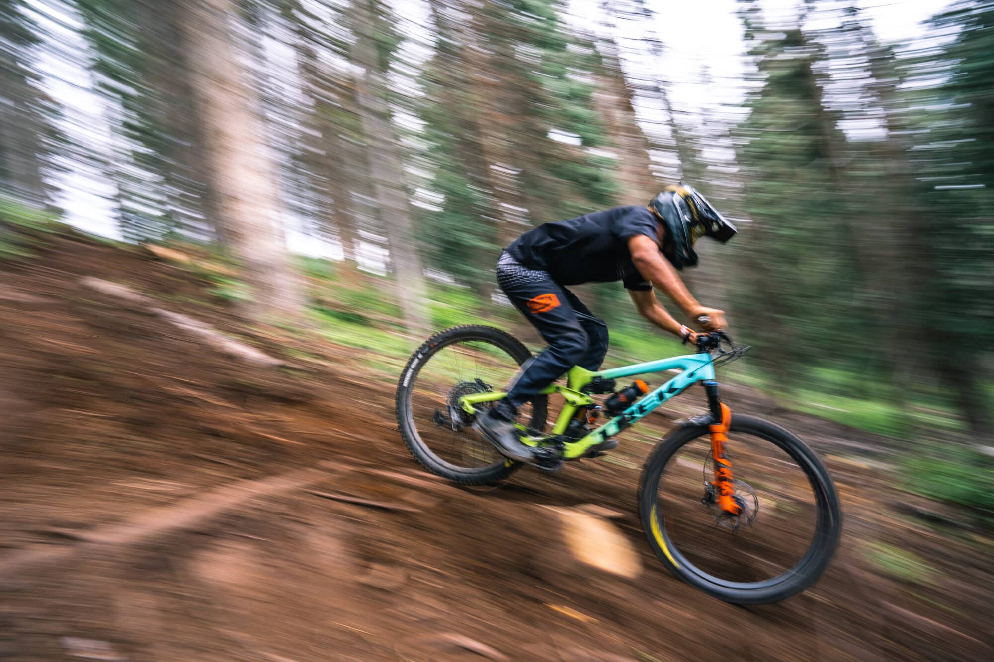 Downhill mountain biker captured at high speed