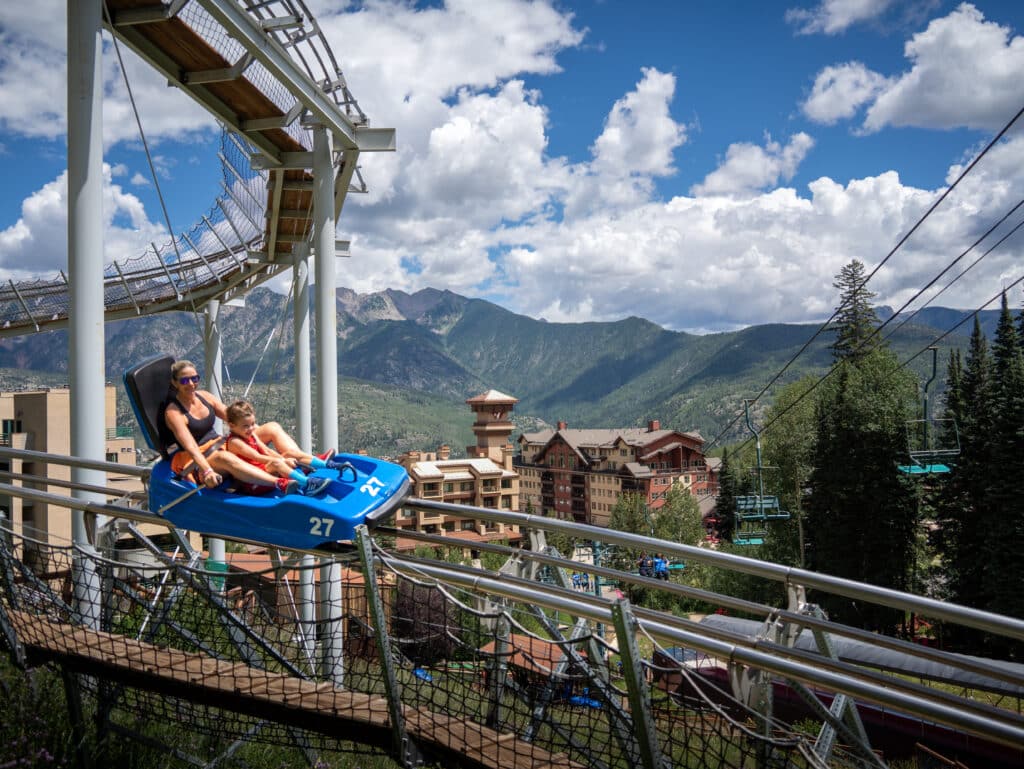Mom and son race down the Inferno Mountain Coaster