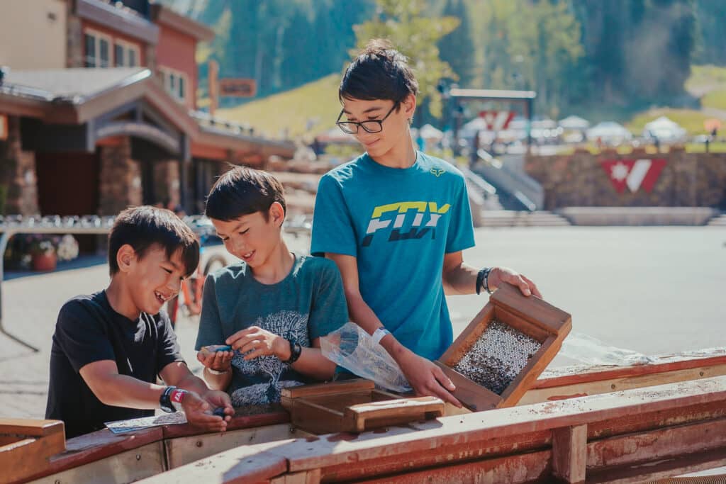 Brothers are thrilled as the discover all the different treasures at the panning trough