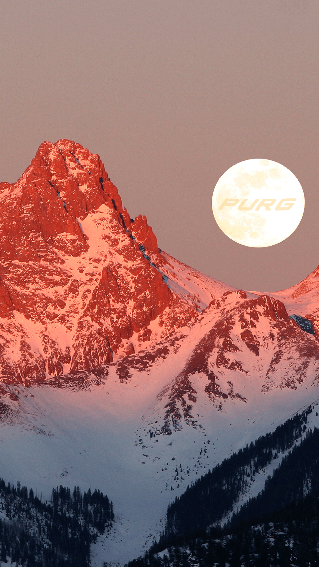 The moon rises between two snowy peaks in a scenic phone background