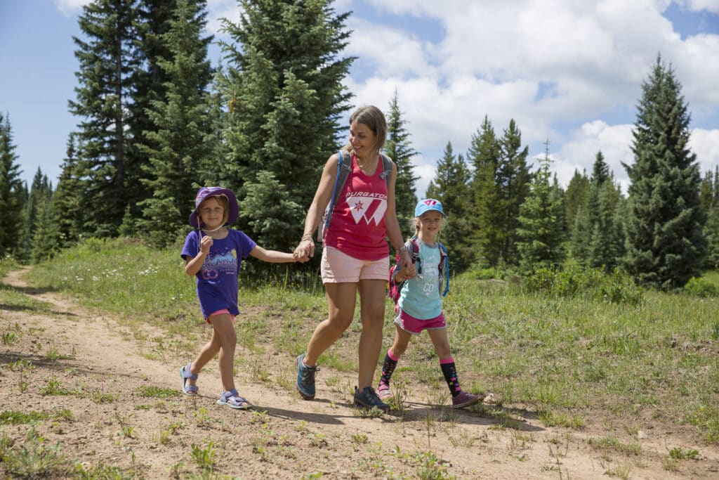 Kids walking on a trail at Purgatory