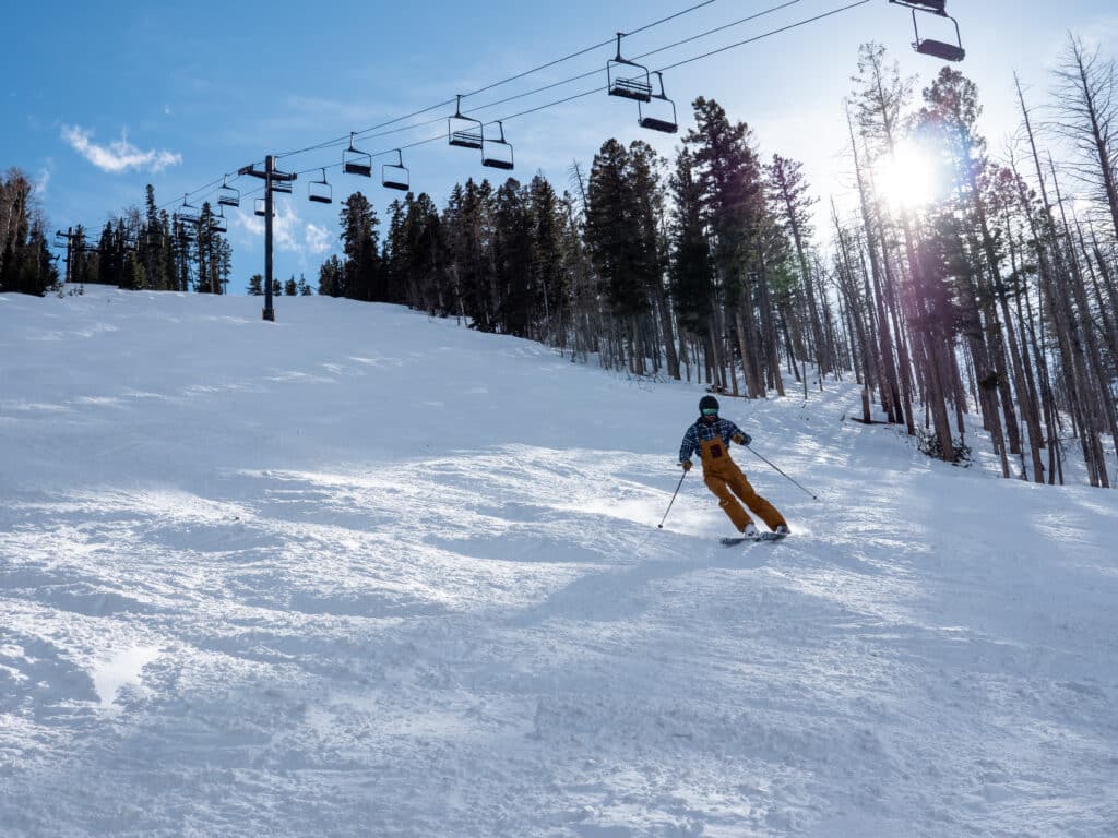 Skier under the lift at Pajarito Mountain