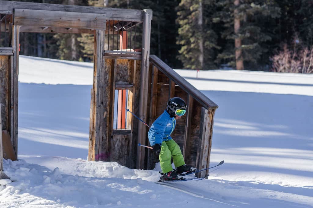 Young skier goes through the Animas City kids park
