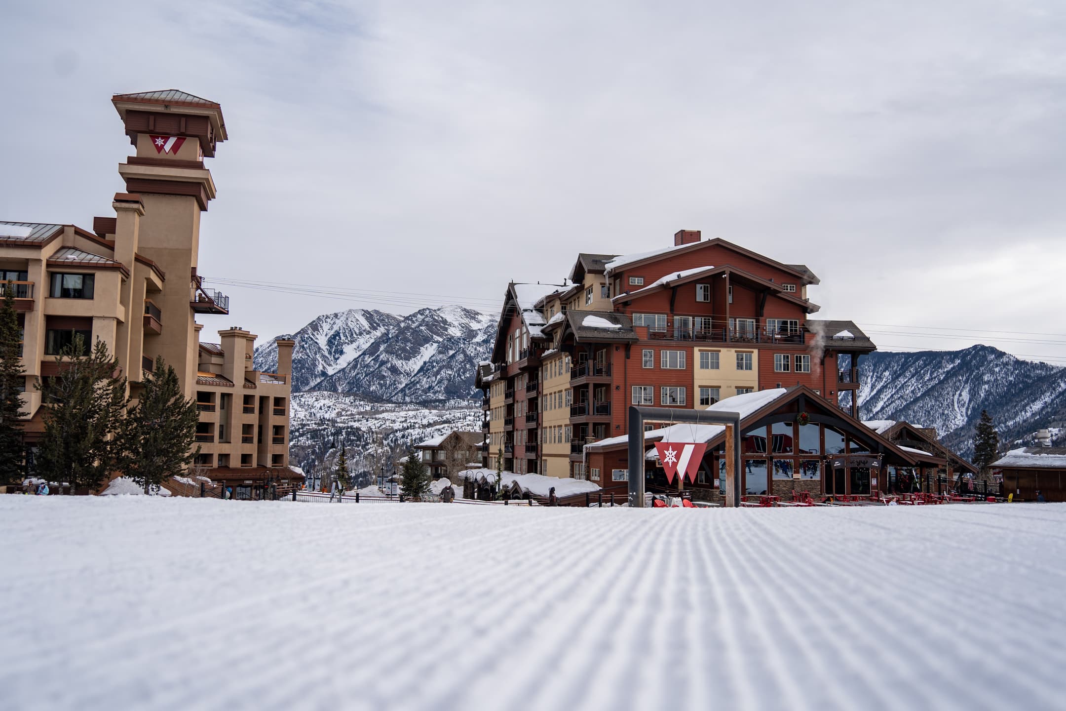 Freshly groomed base area of Purgatory Resort on an overcast morning