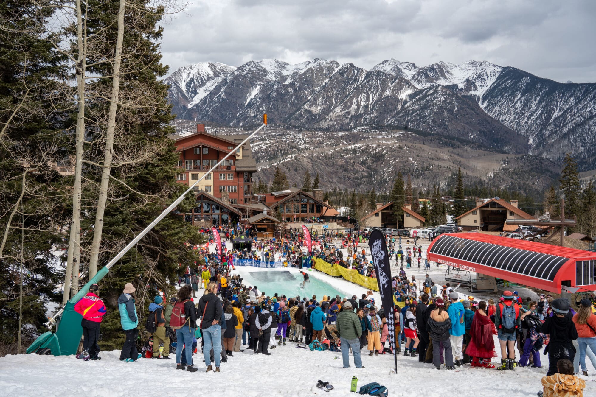 Crowd gathers to watch the annual pond skim at Purgatory Resort