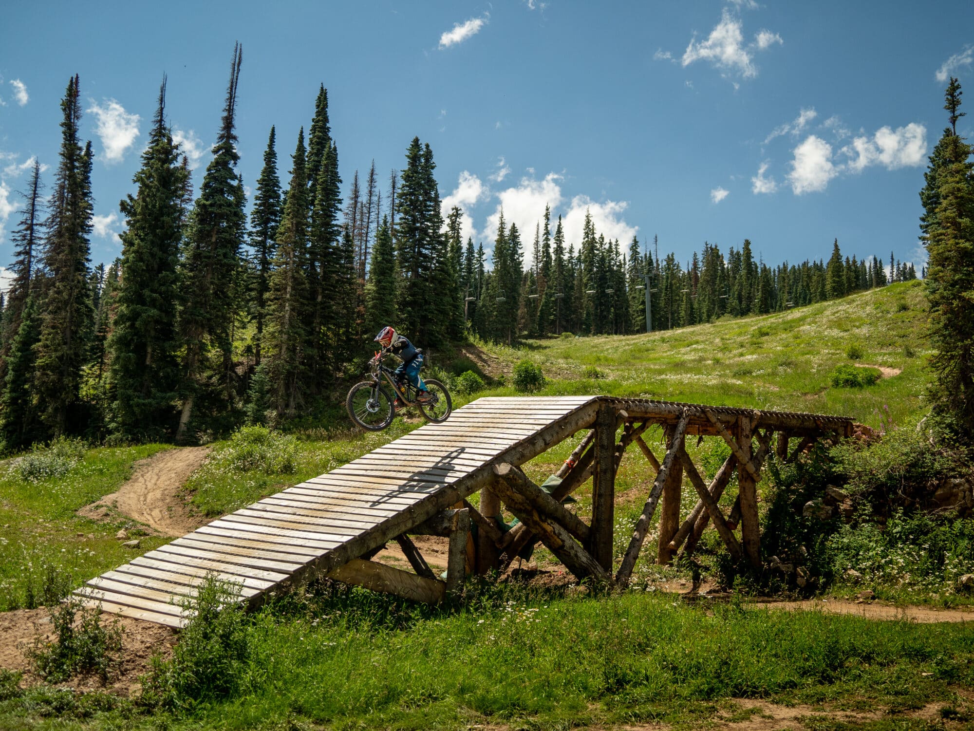 Young DEVO rider launches off the edge of a man made feature