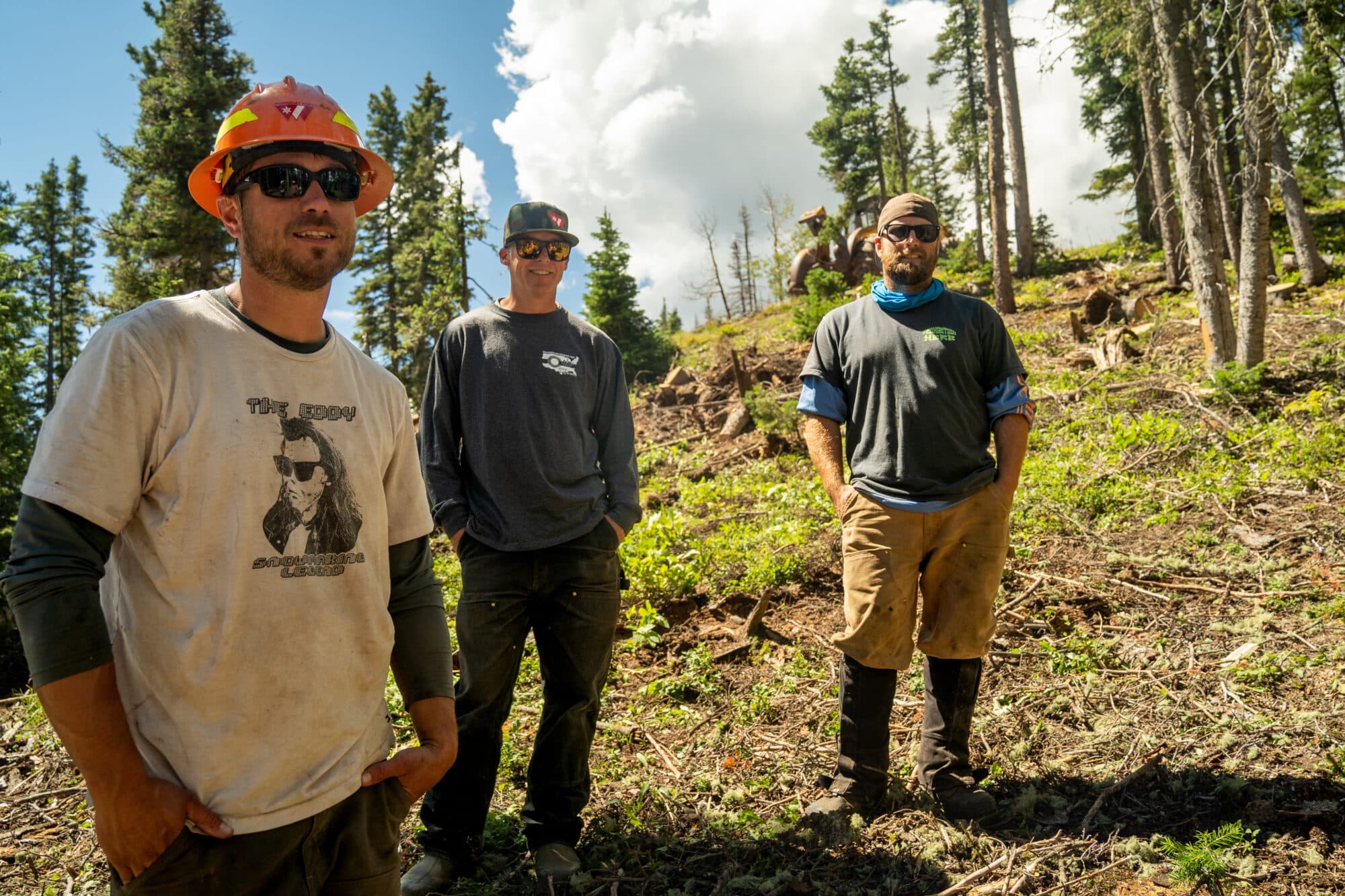 Slopes manager and team pose for a photo during hazardous tree removal and fire mitigation project