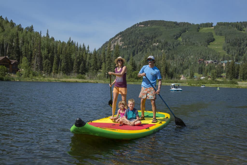 Family cruises around Twilight Lake on a Sol Paddle Board big enough for the whole family