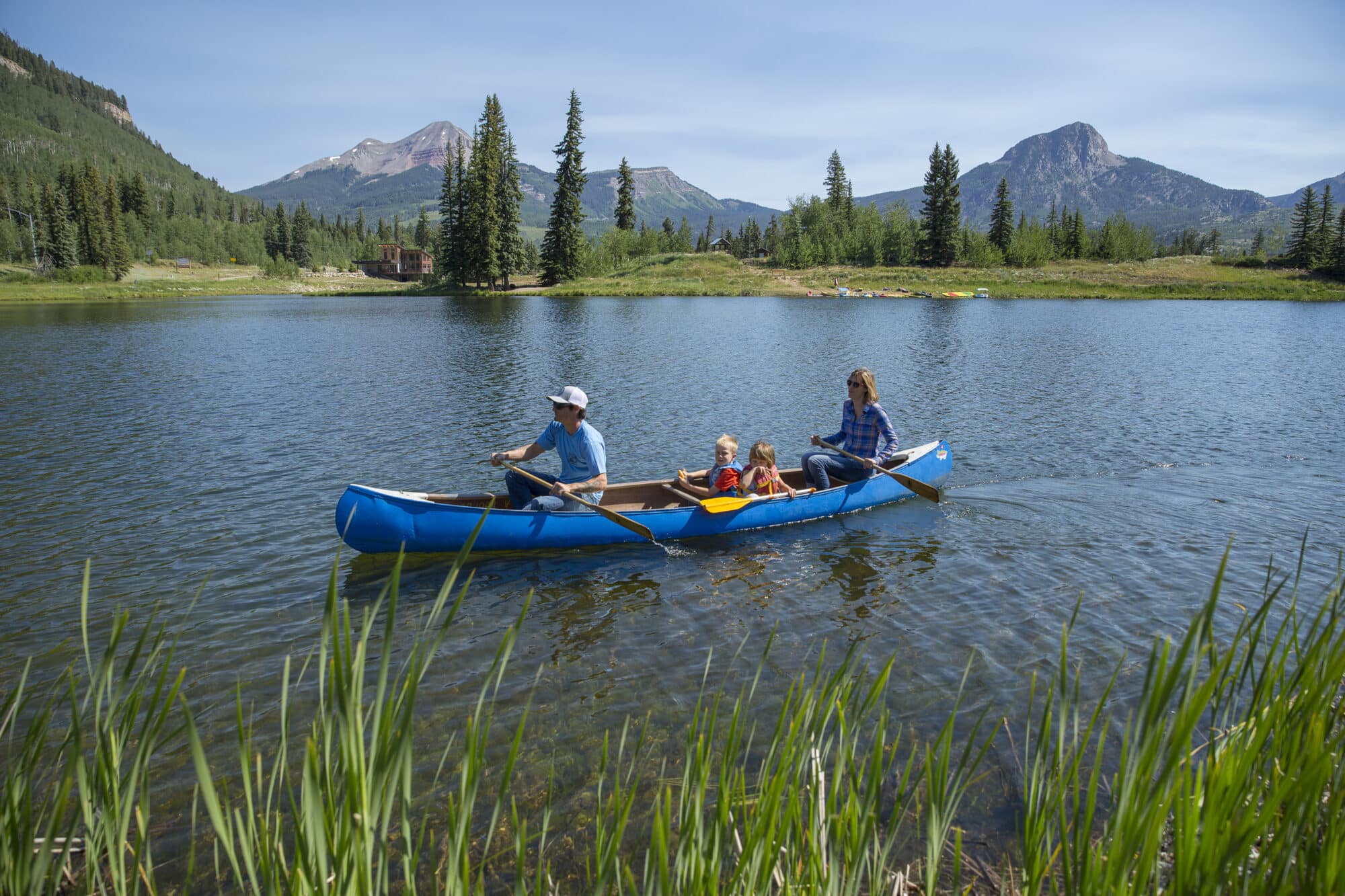 Family takes in the views from a canoe on Twilight Lake