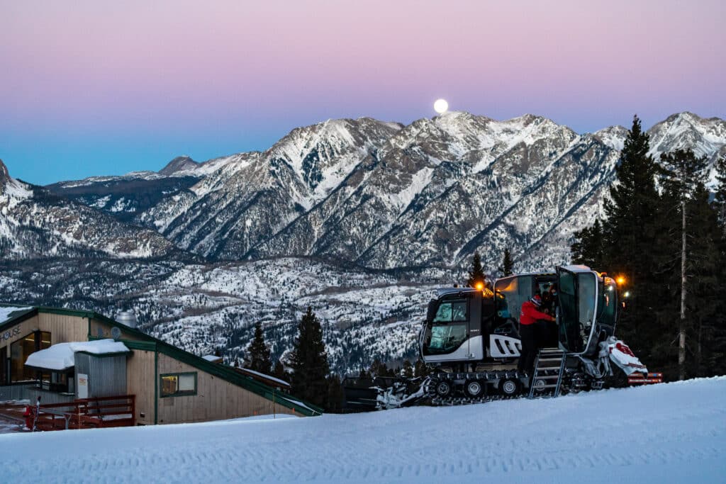 Passengers unload the snowcat at Powderhouse to enjoy a mountain top dining experience