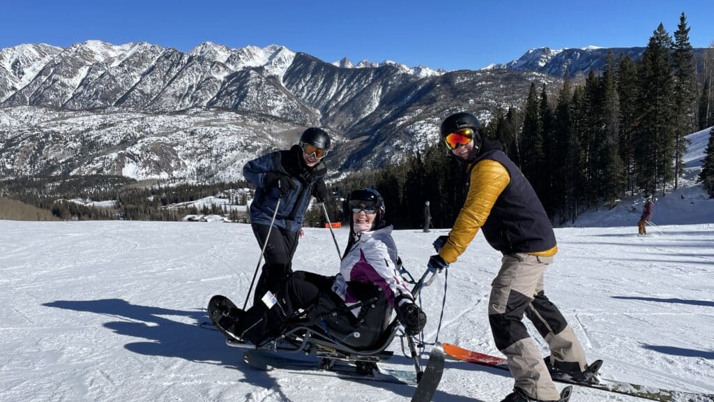 Adaptive mono ski lessons brings joy to both students and instructors