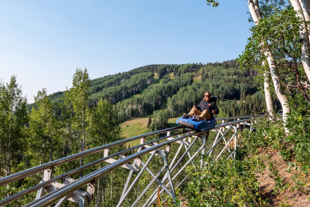 Purgatory employee takes a ride on the Inferno Mountain Coaster
