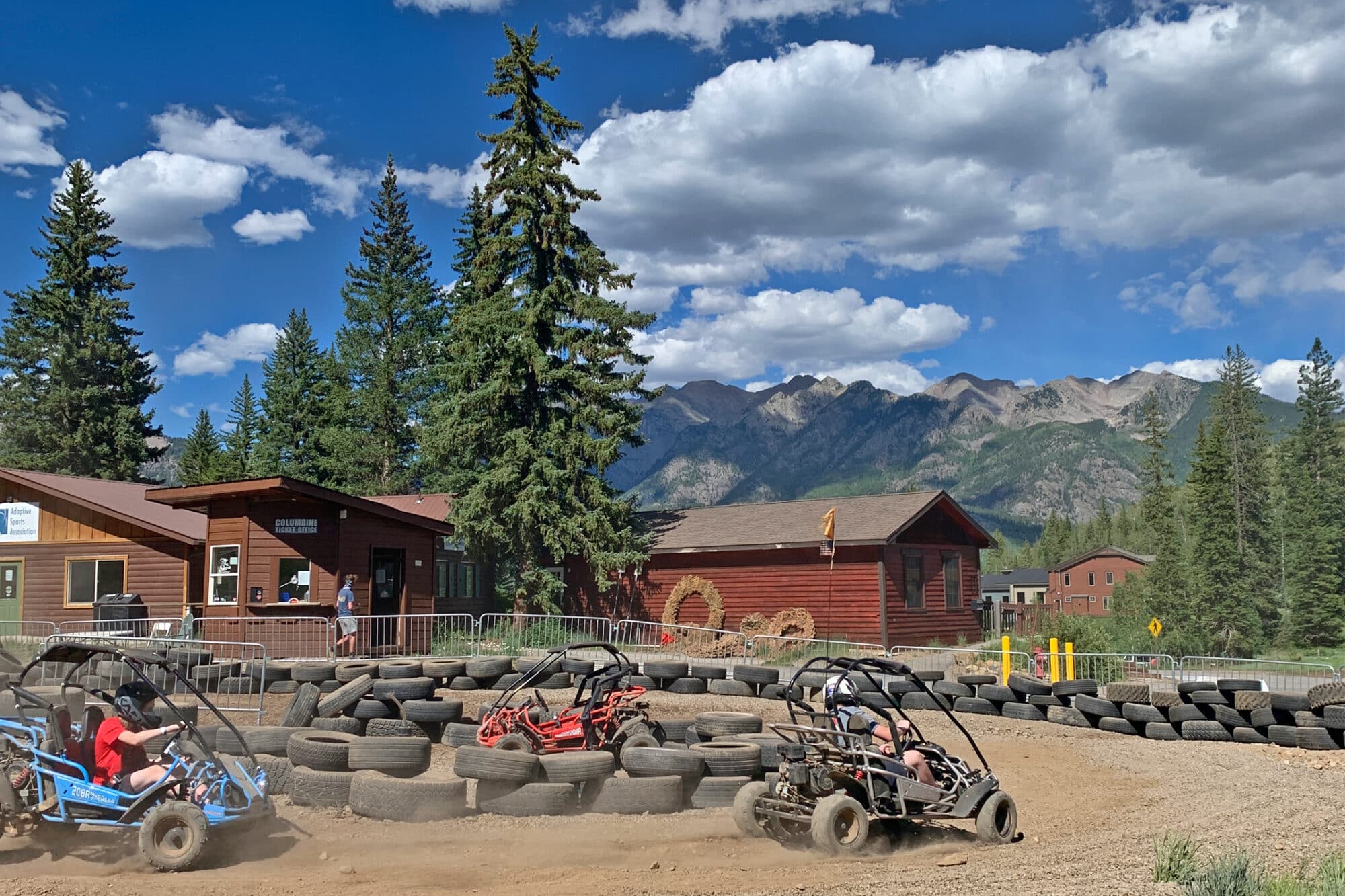 Racers drift the turns on the dirt track