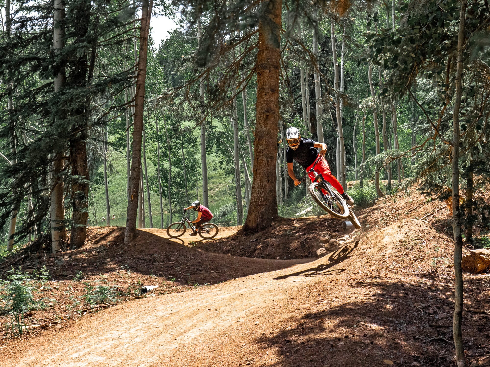 Mountain bikers take on the twist and turns of the bike park trails