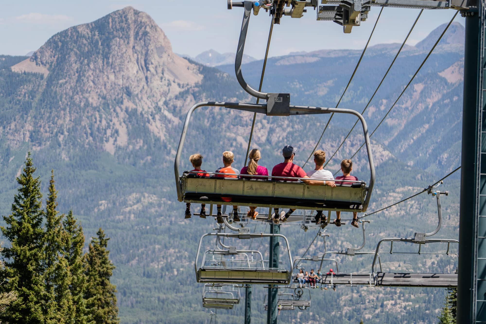 Family enjoys the view heading down the scenic chairlift