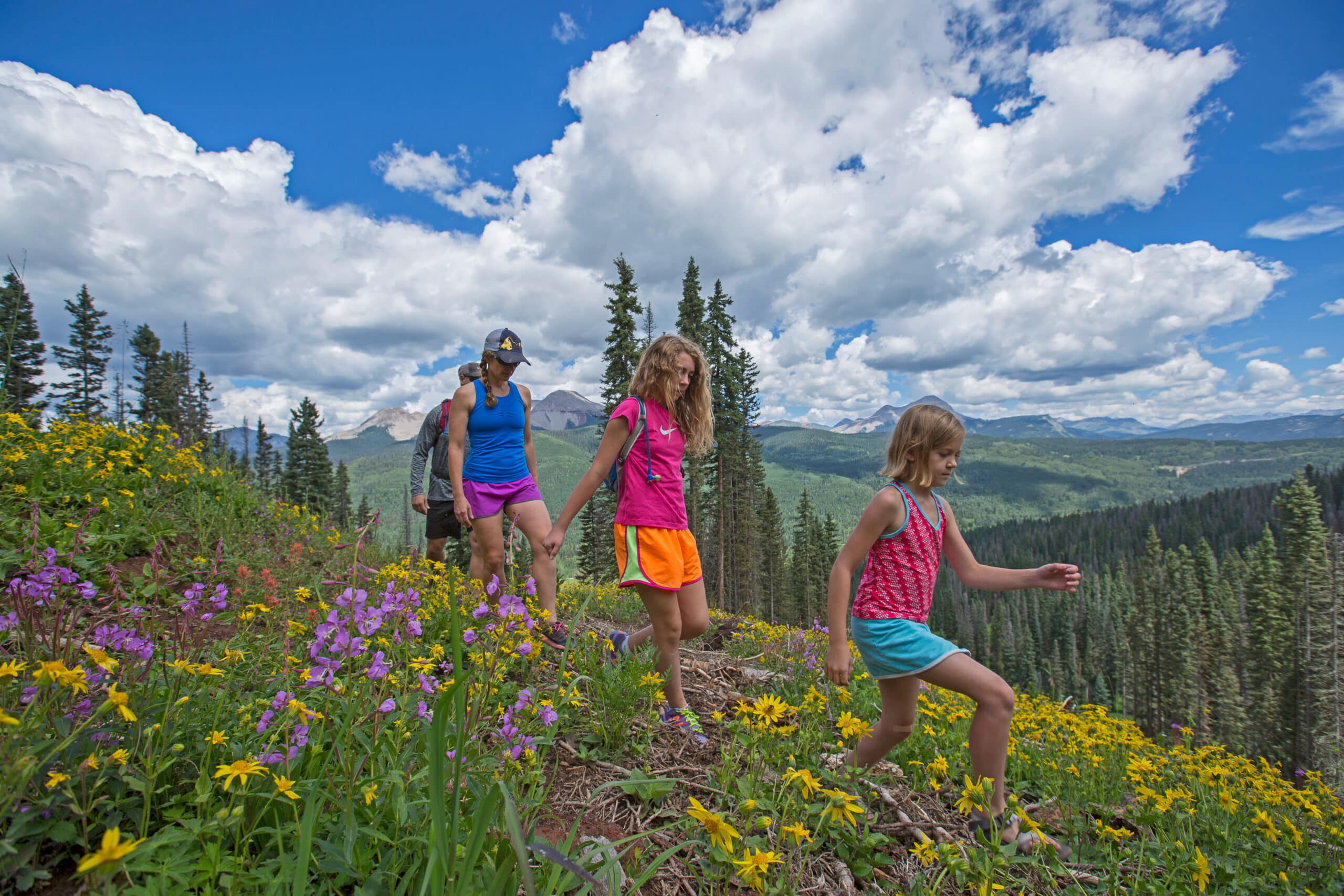 Family hikes through fields of wildflowers at Purgatory Resort