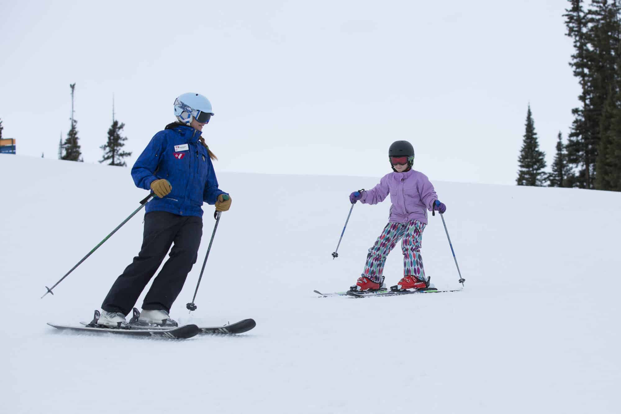 Ski school instructor teaches how to switch edges on skis