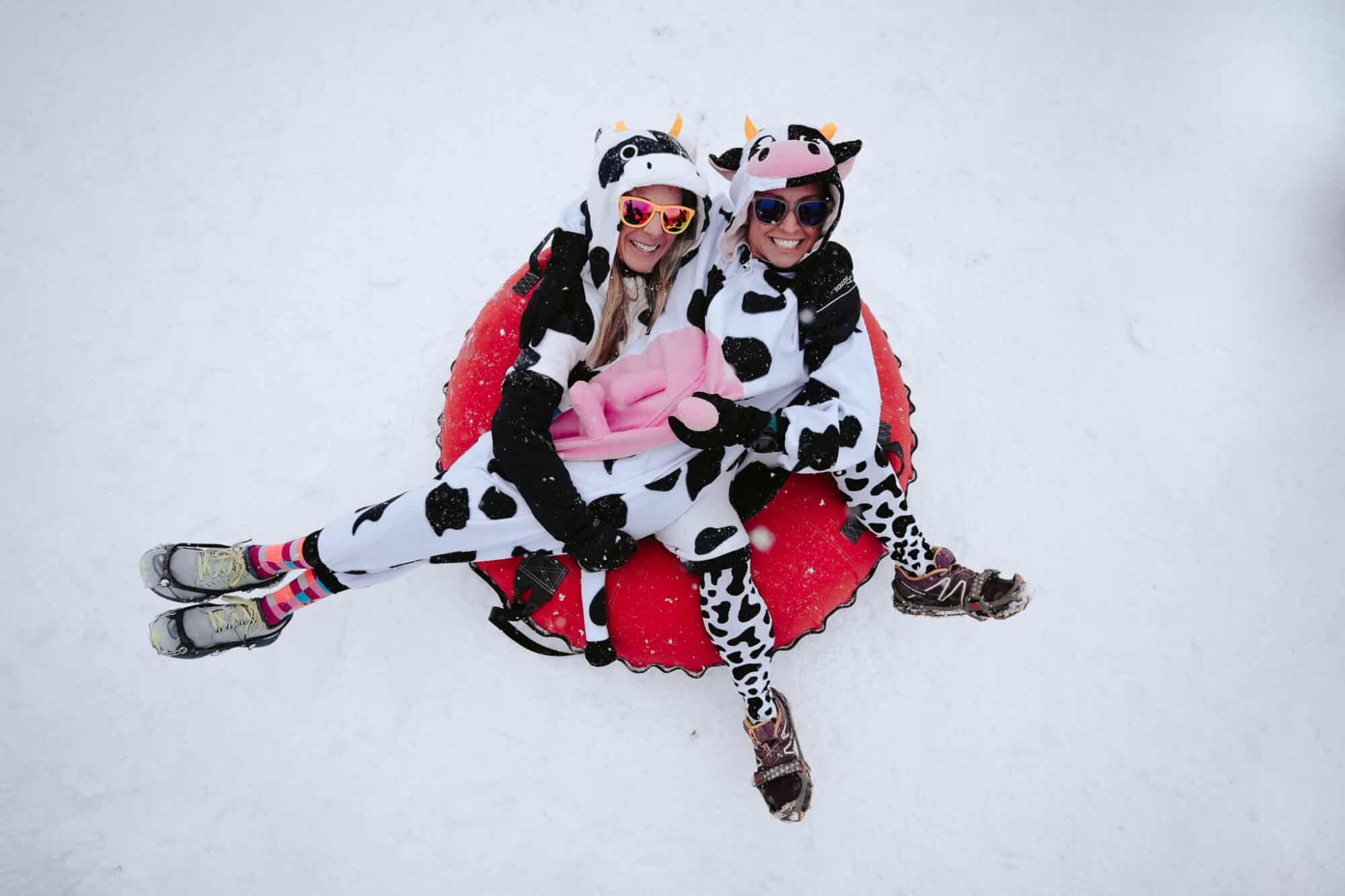 Girls dressed up as cows hanging out on their tube at the Uncle Clyde's Run and Slide