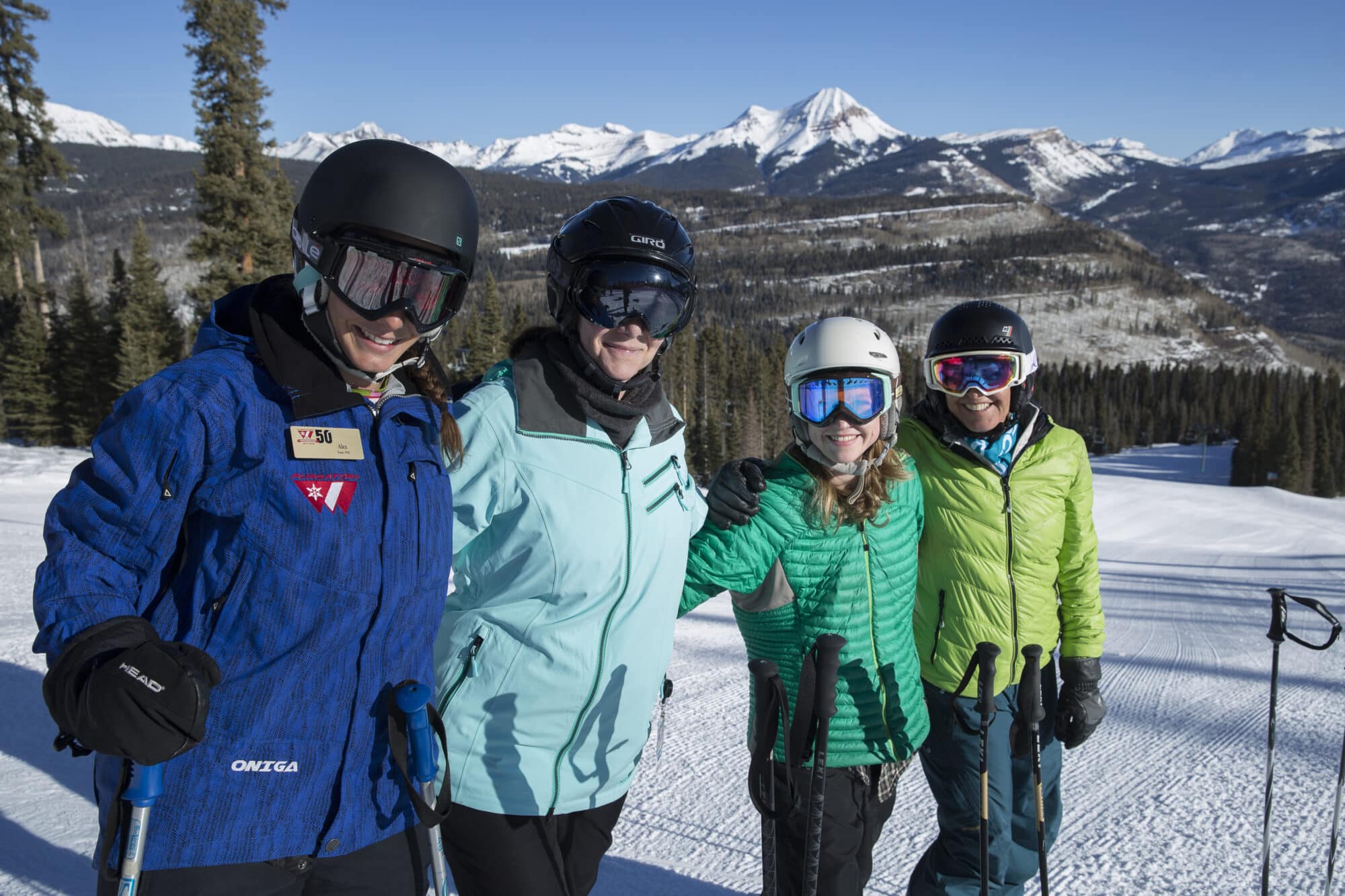 Women's group ski clinic group poses for a photo