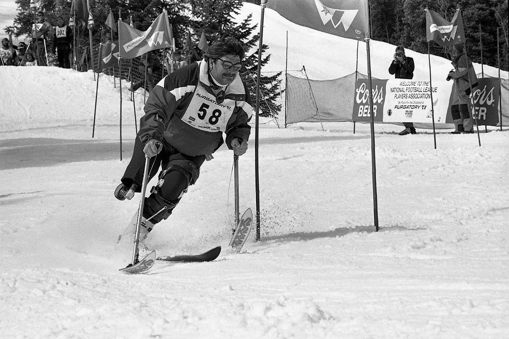 A man competes in the Dave Spencer Ski Classic skiing on one ski