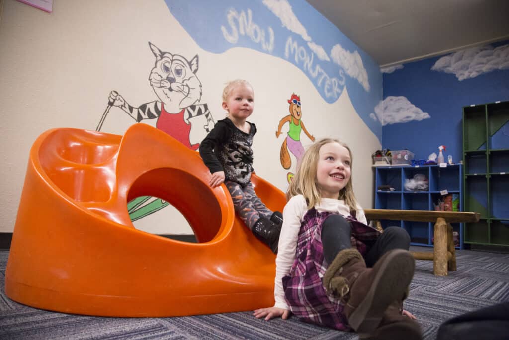 Kids playing in the Bear's Den childcare center
