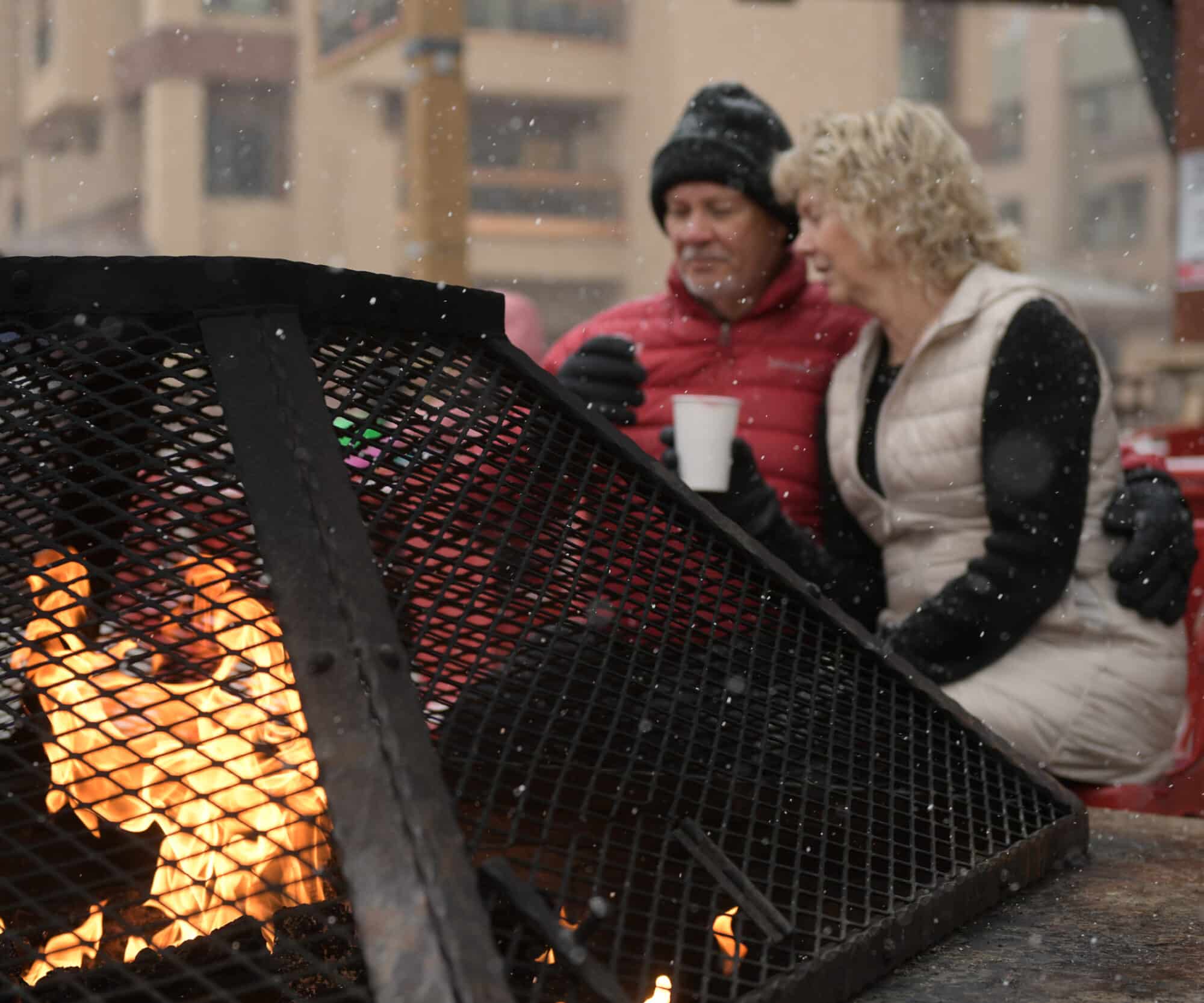 people sitting around fire