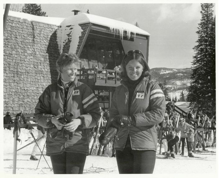 two vintage skiers