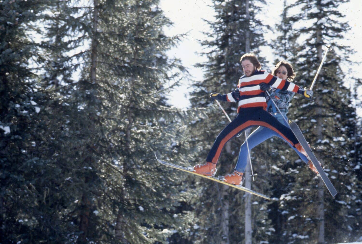 two guys doing a ski jump - vintage