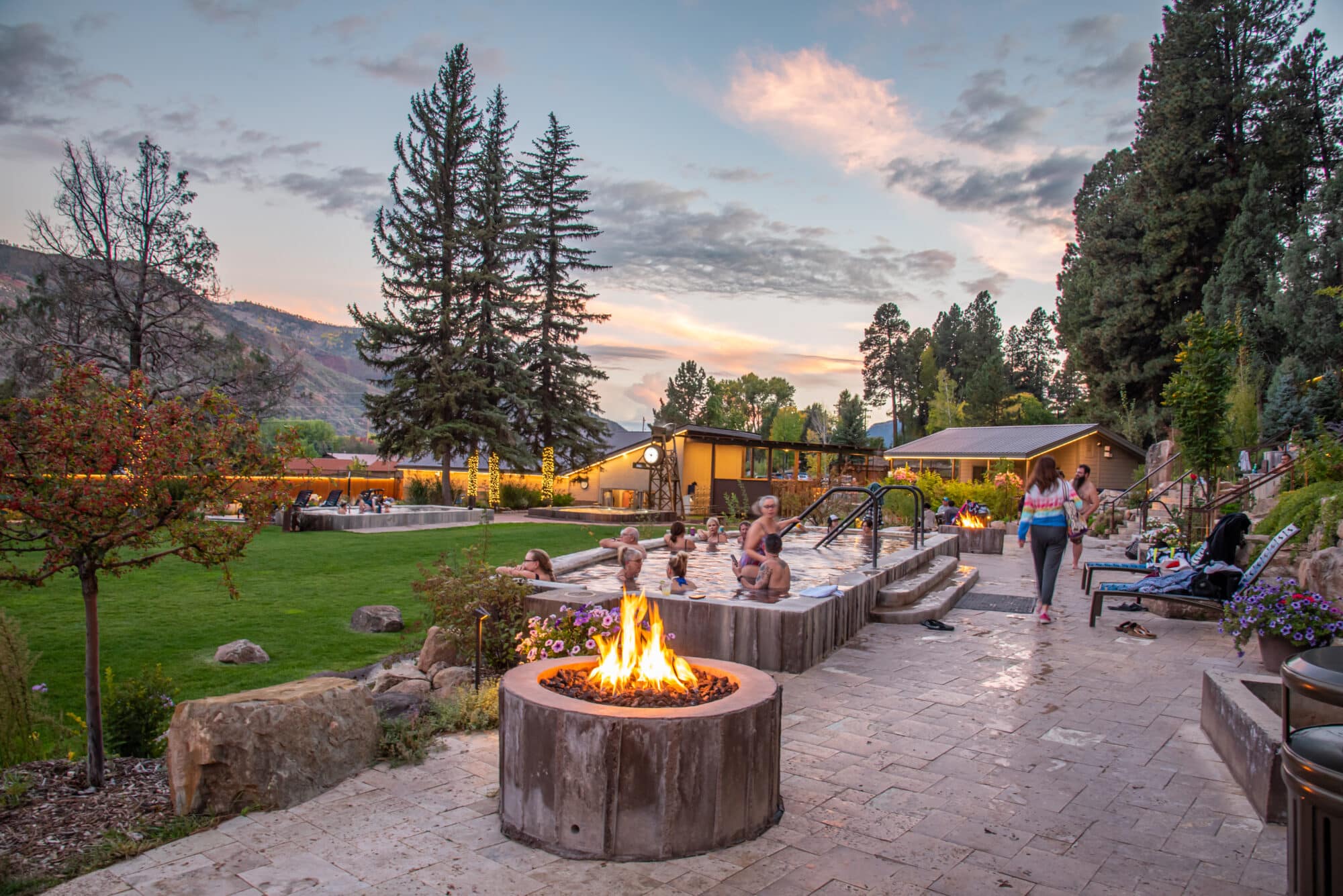 A fire place and hot springs pool at sun set at Durango Hot Springs