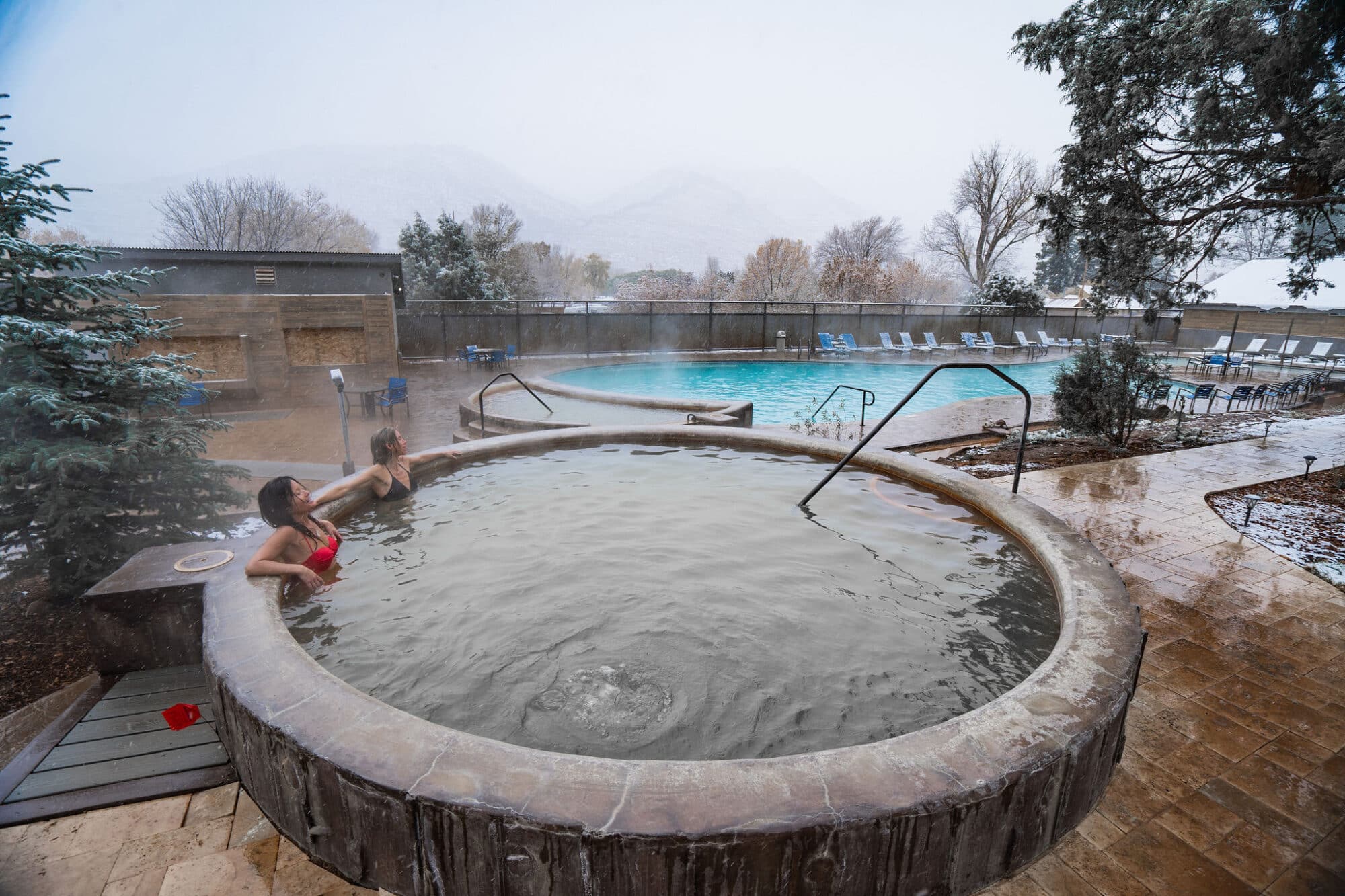 Two women soak in one of the hot pools at Durango Hot Springs resort