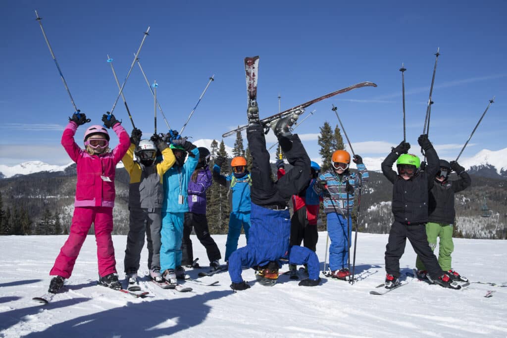 Happy kids on ski mountain