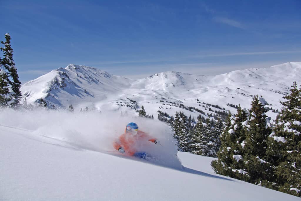 Skier take a fresh powder turn at Loveland Ski Area