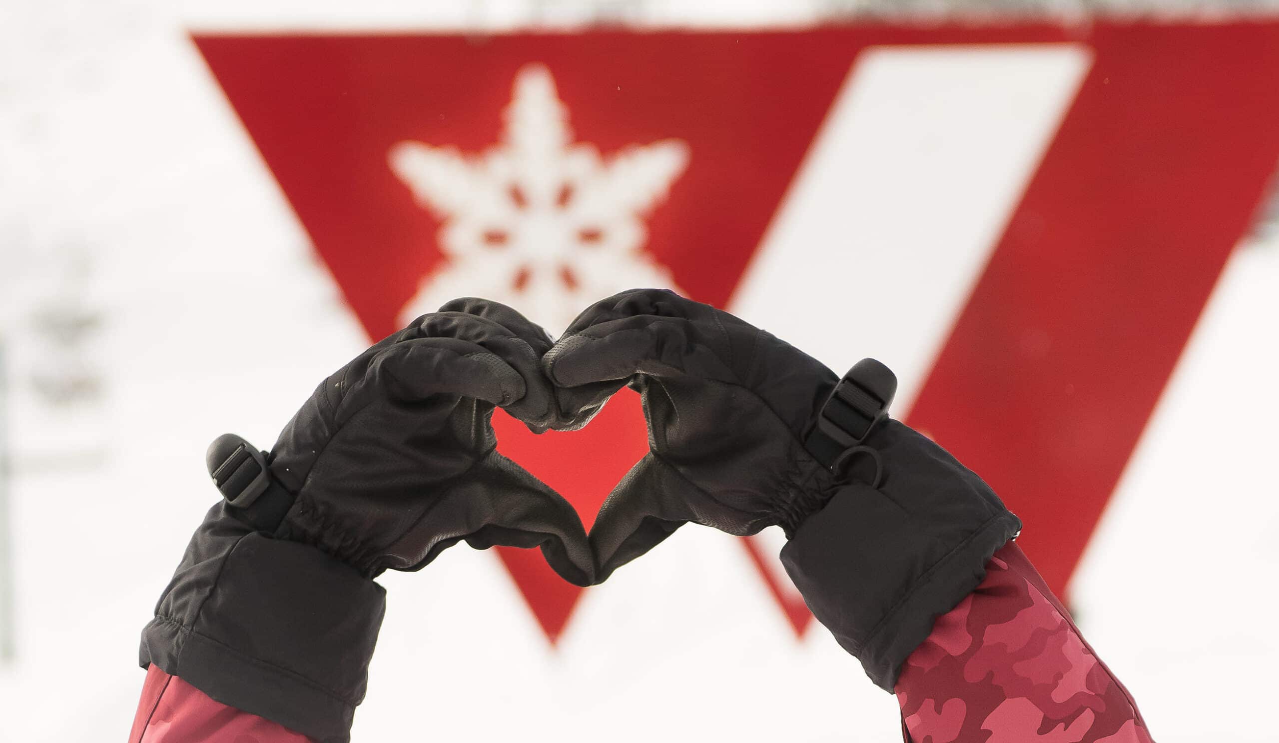 hands making a heart around the Purg logo