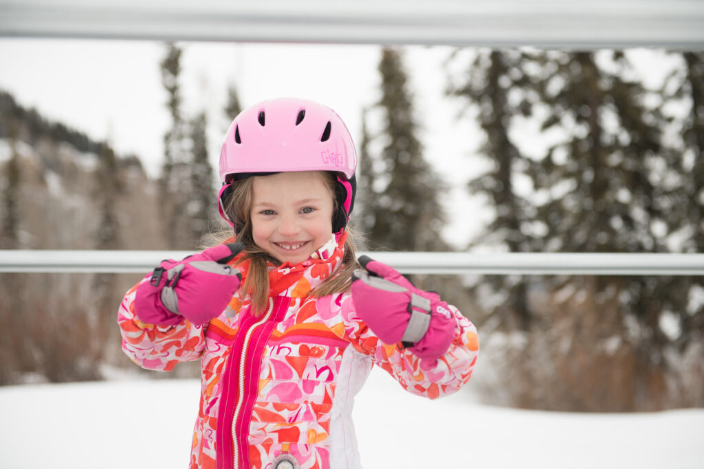 Young girls smiles while on the magic carpet