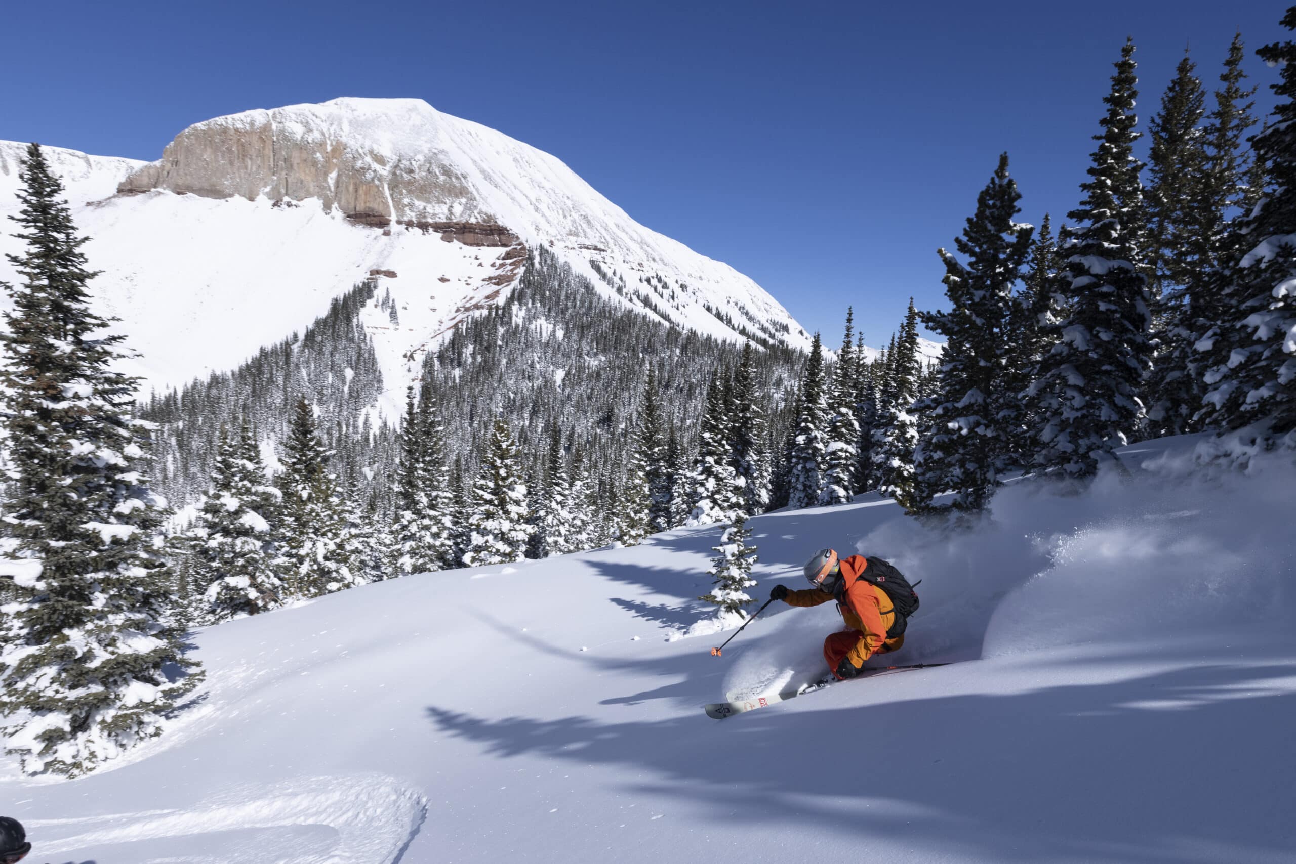 Skiing takes first down down a step pitch on a snowcat skiing trip