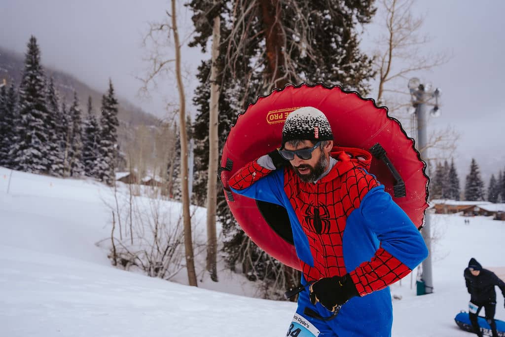 man carrying tube