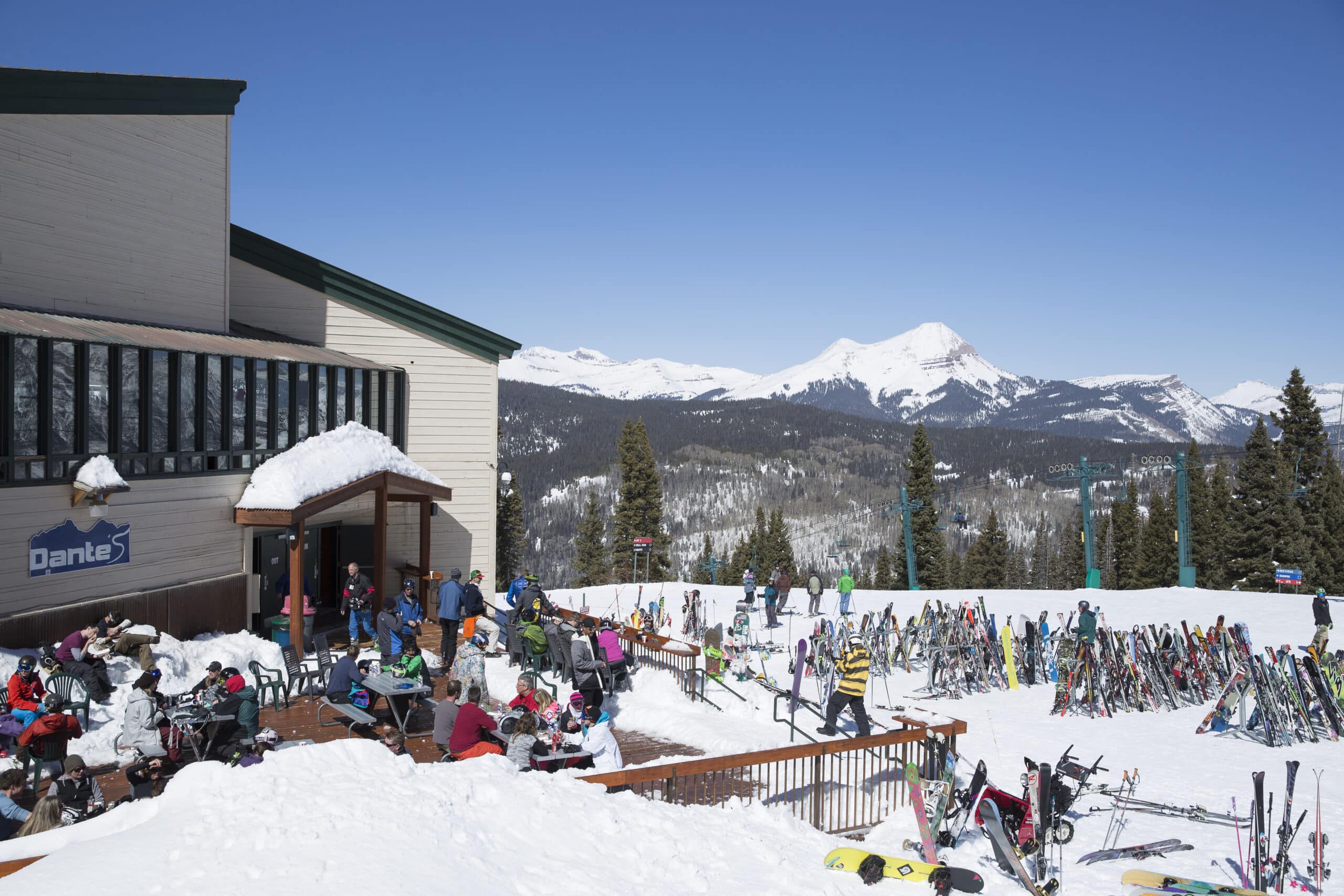 People gather on the snowy deck at Dante's