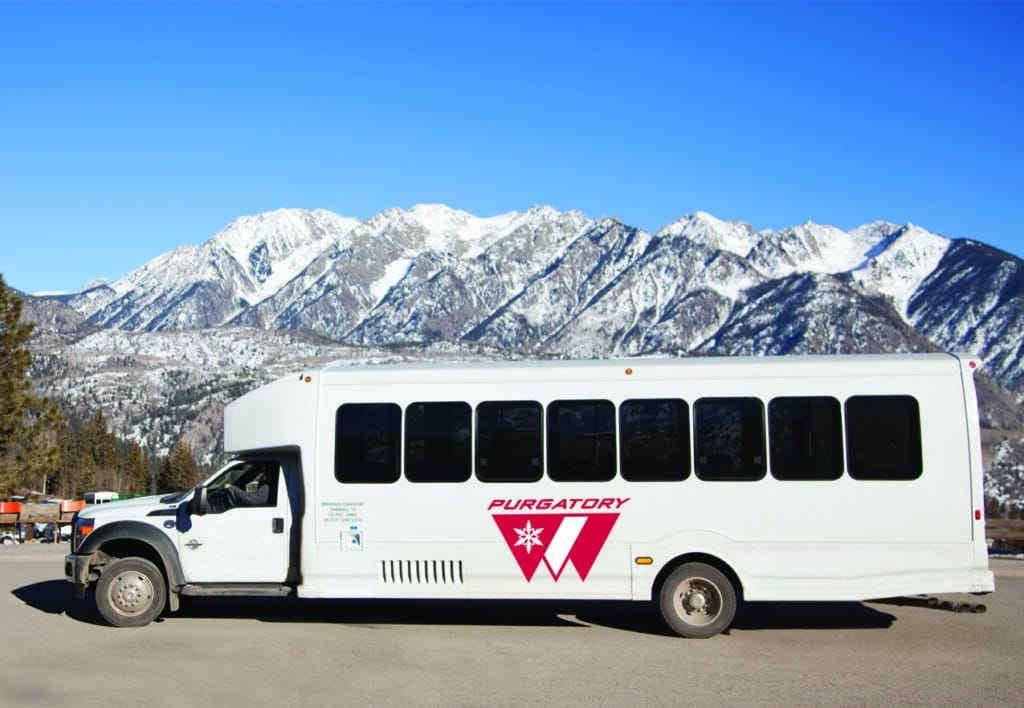 A Purgatory shuttle bus waits in the parking lot
