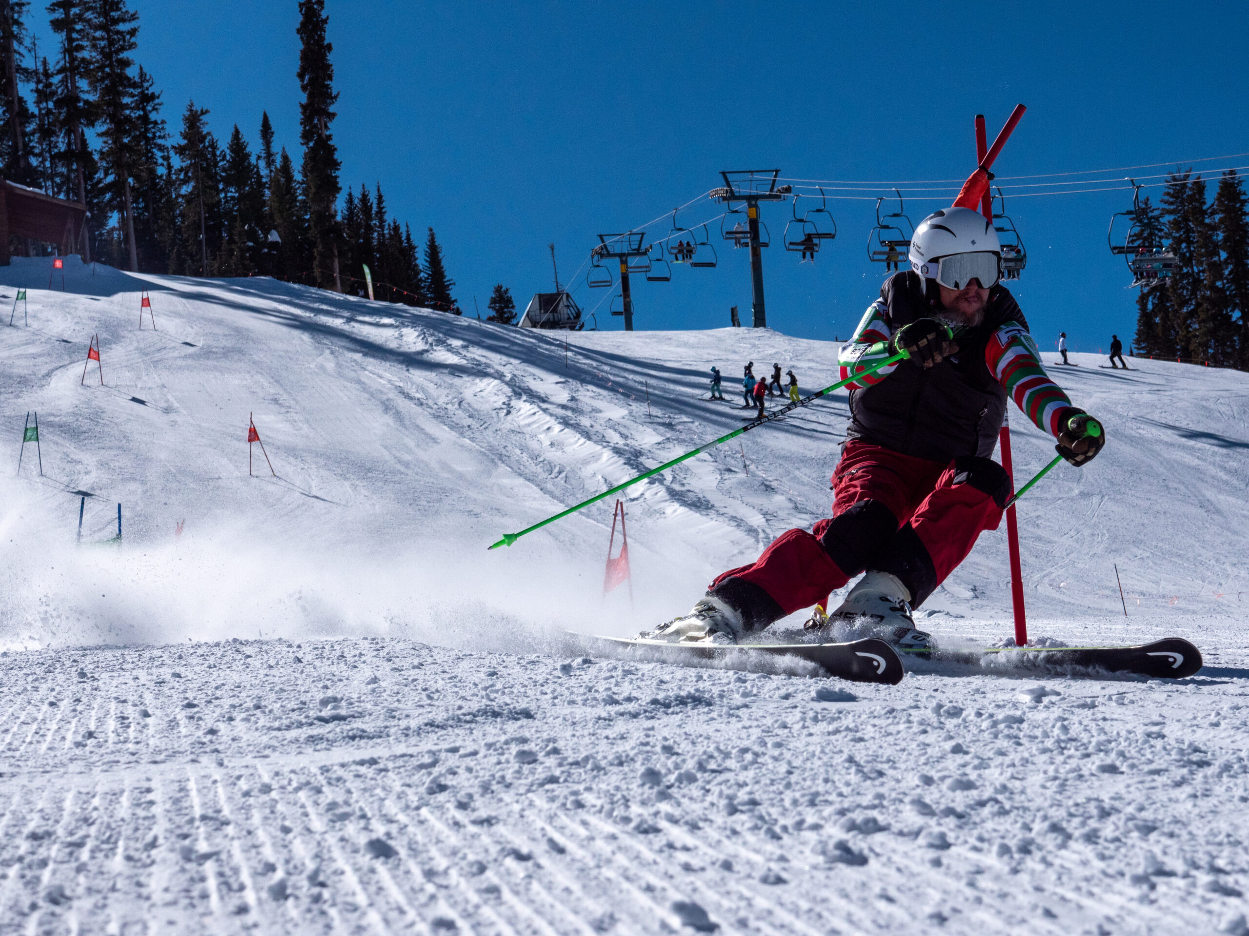A man races down a slalom course during a ski competition