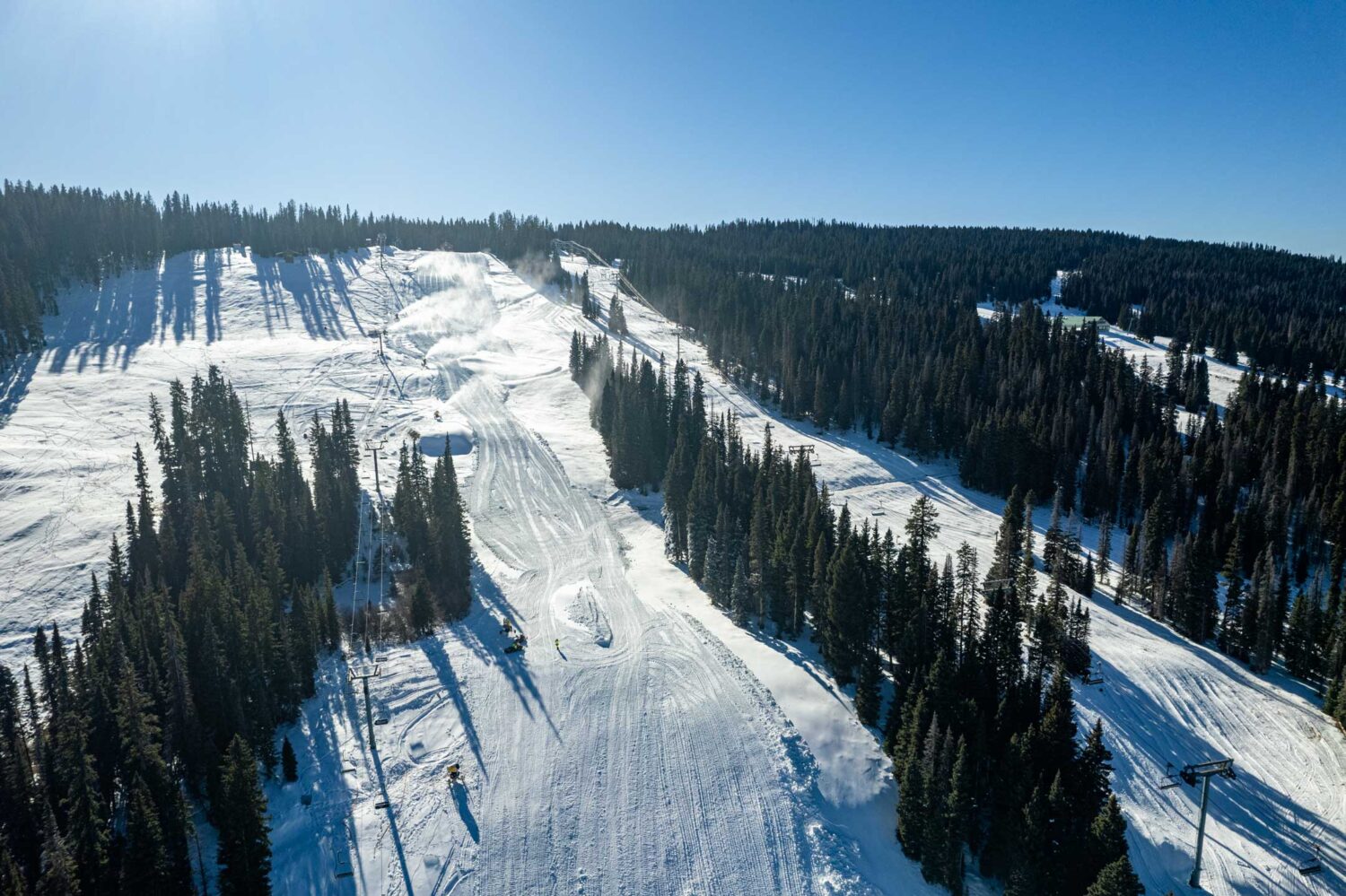 Snow guns blow snow on the slopes at Purgatory