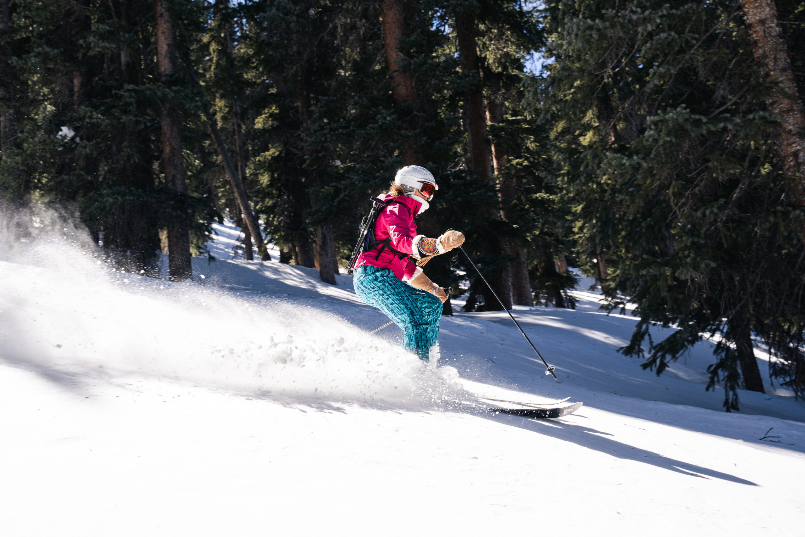 A woman skis in the backcountry