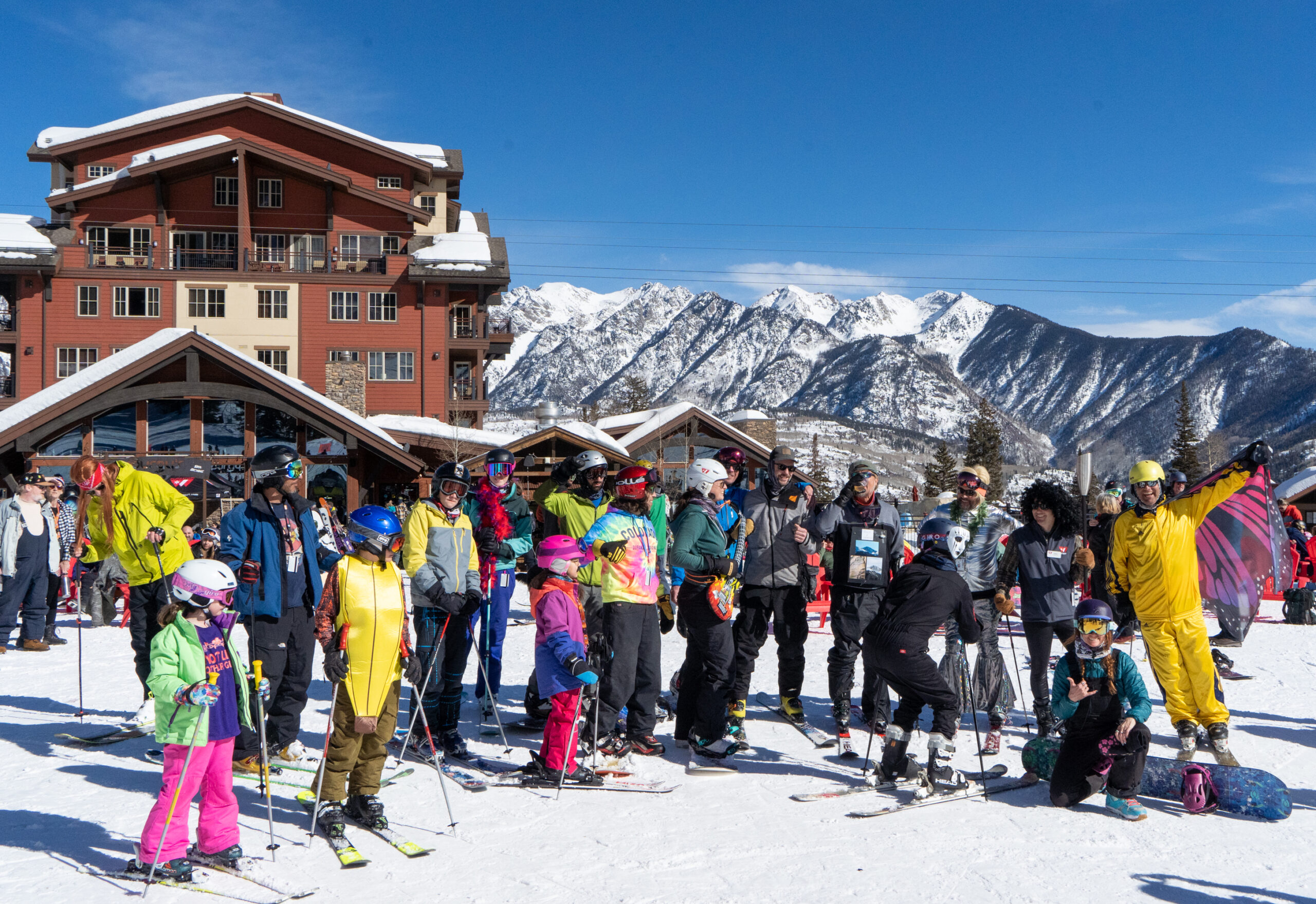 A group in costumes gather around for a photo