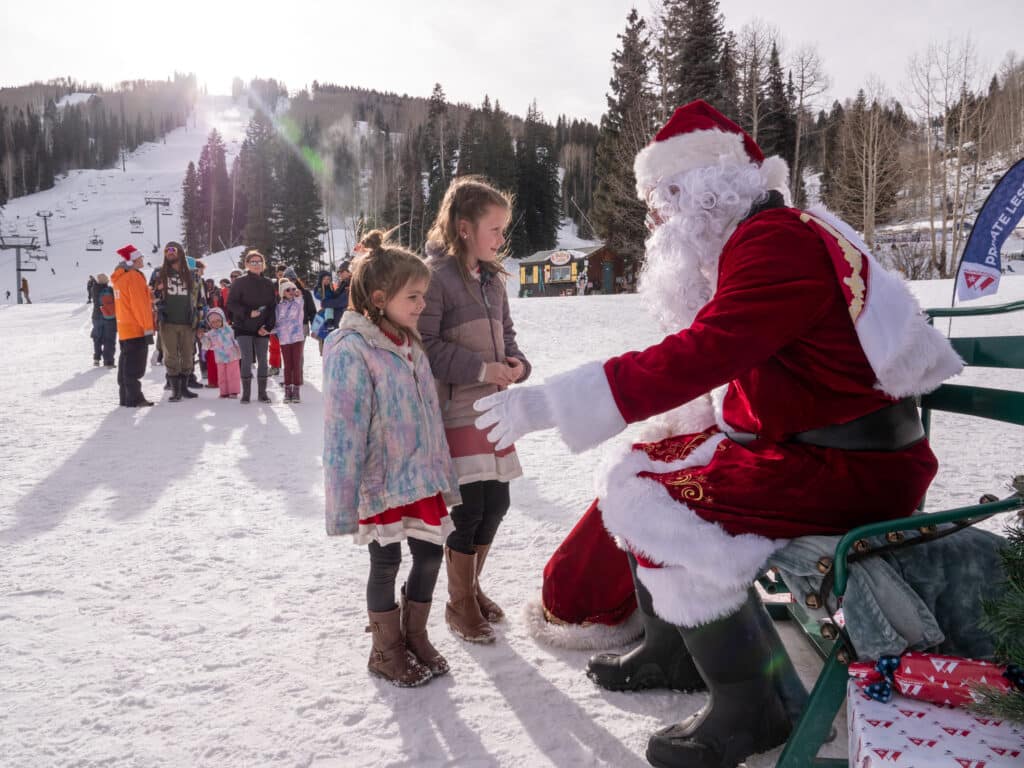 Santa and Mrs. Claus with guest