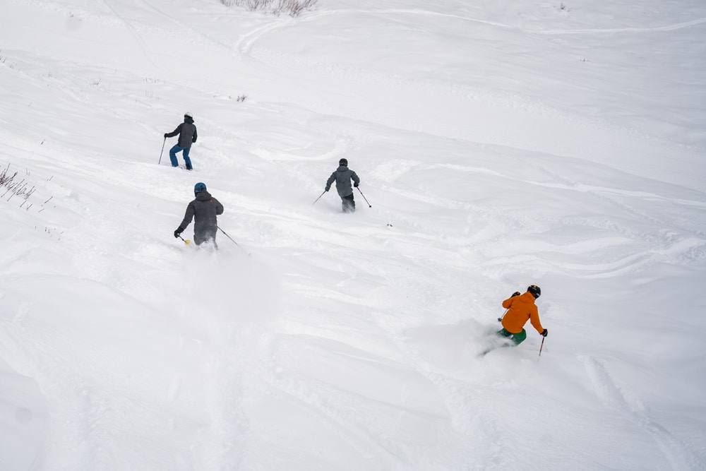 Skiers in fresh powder