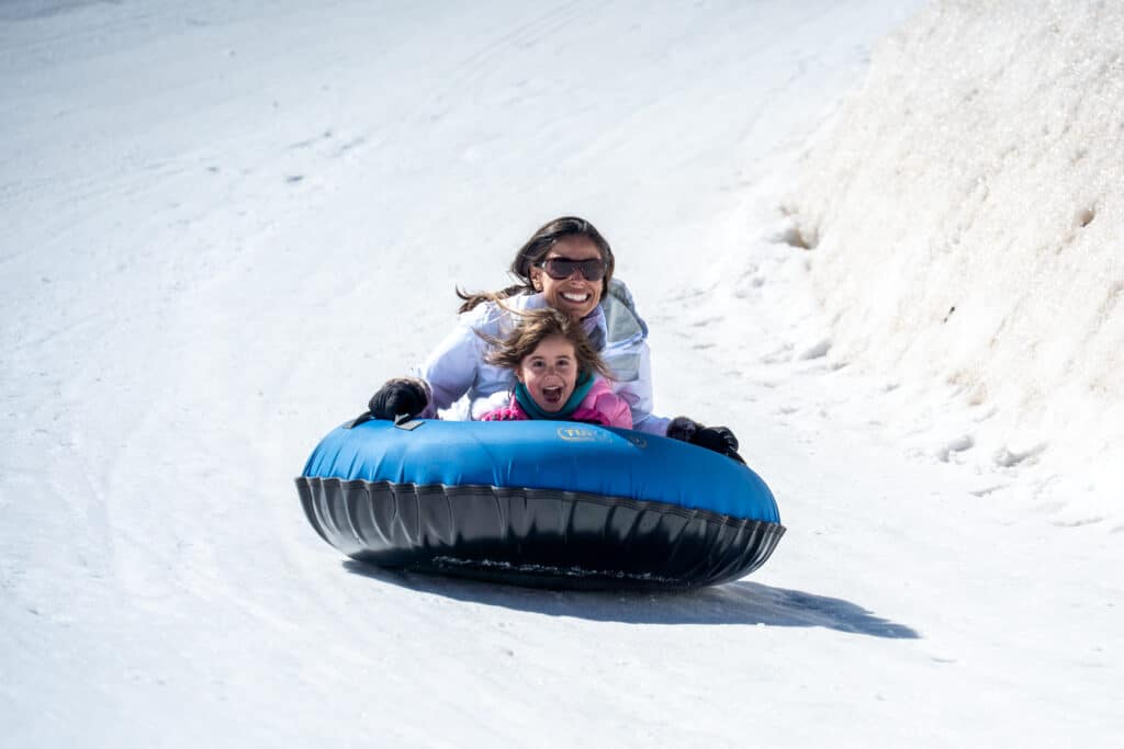 Mother and daughter on a tubing ride