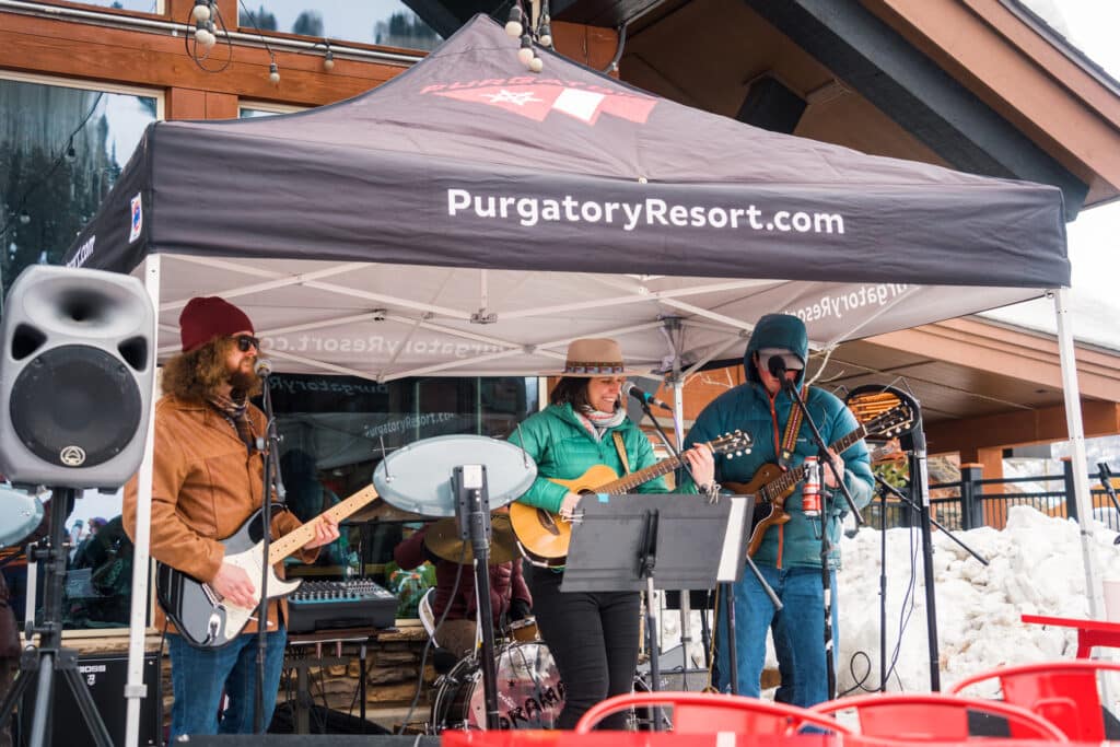 a band plays out on a snowy patio